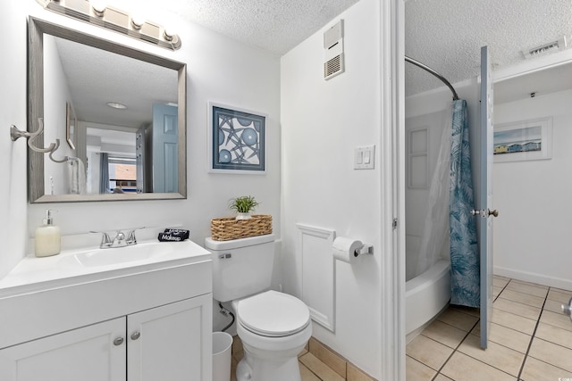 full bath with toilet, shower / bath combo with shower curtain, a textured ceiling, vanity, and tile patterned floors