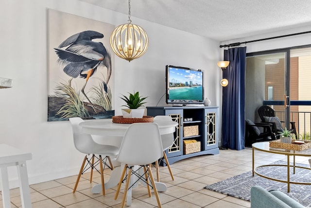 dining room with a notable chandelier, a textured ceiling, and light tile patterned floors