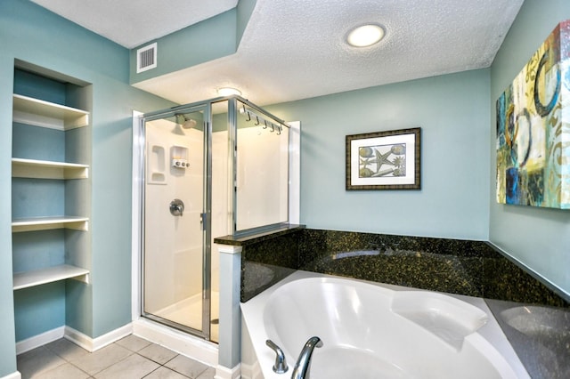 bathroom featuring built in features, plus walk in shower, tile patterned flooring, and a textured ceiling