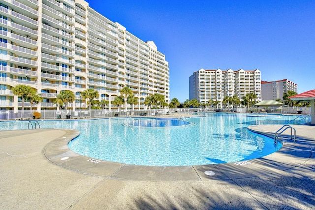 view of swimming pool with a patio area