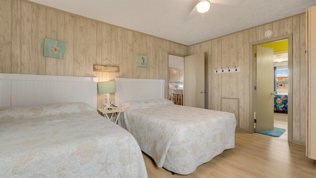 bedroom with light wood-type flooring and ceiling fan