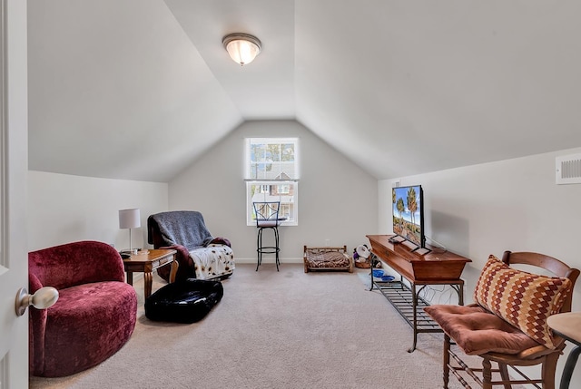 sitting room featuring vaulted ceiling and carpet floors