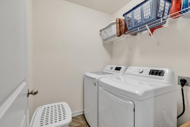 laundry area with washing machine and dryer