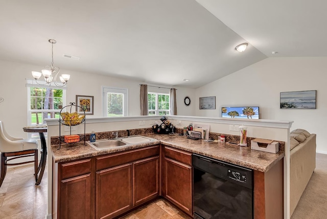 kitchen featuring sink, a wealth of natural light, hanging light fixtures, and black dishwasher