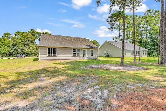 back of house with a yard