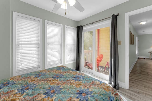 bedroom with ceiling fan and hardwood / wood-style flooring