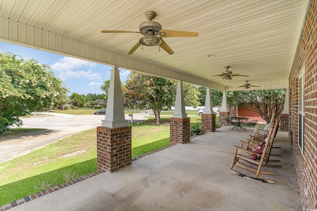 view of patio featuring ceiling fan and a porch