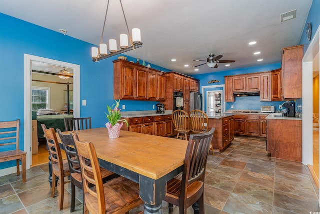 dining space featuring ceiling fan