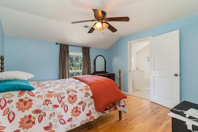 bedroom featuring ensuite bathroom, lofted ceiling, ceiling fan, and light hardwood / wood-style floors