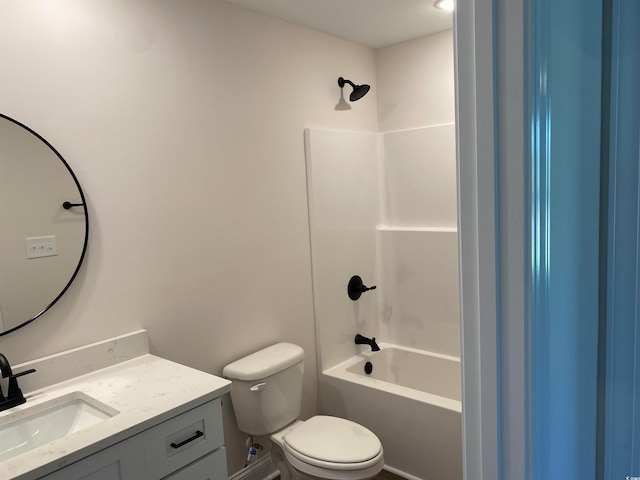 full bathroom with bathtub / shower combination, vanity, and toilet