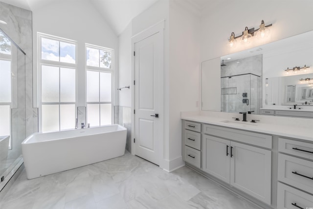 bathroom featuring vanity, independent shower and bath, and vaulted ceiling