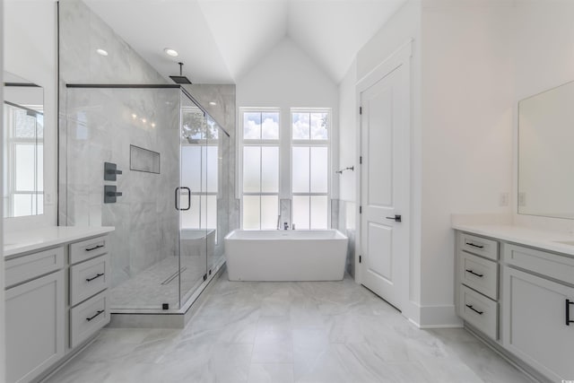 bathroom featuring plus walk in shower, vanity, a wealth of natural light, and lofted ceiling