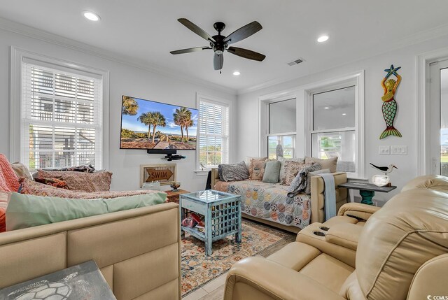 living room with crown molding and ceiling fan