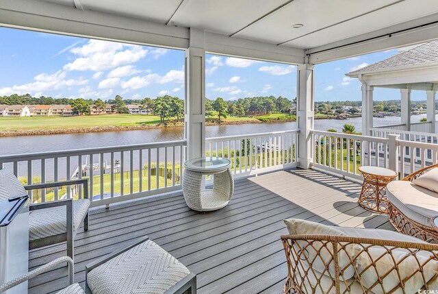 wooden terrace with a water view