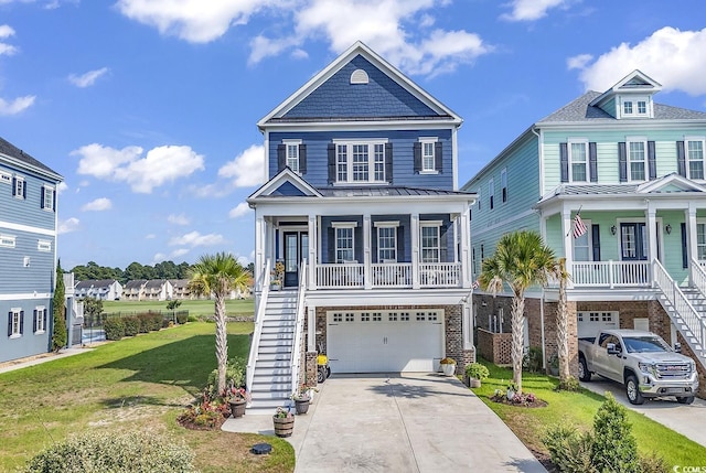 view of front of house featuring a garage, covered porch, and a front lawn