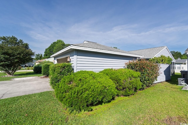 213 Birkdale Ln, Myrtle Beach, SC 29588 - view of side of property featuring a garage, a yard, and driveway
