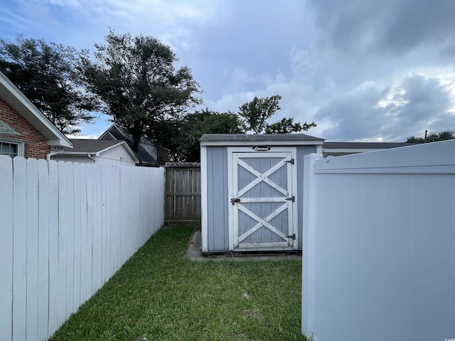 view of shed featuring fence