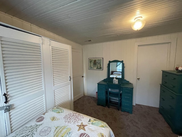 bedroom with wood ceiling, carpet, and visible vents