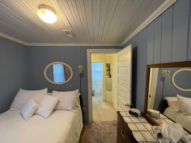 carpeted bedroom featuring ornamental molding and wood ceiling