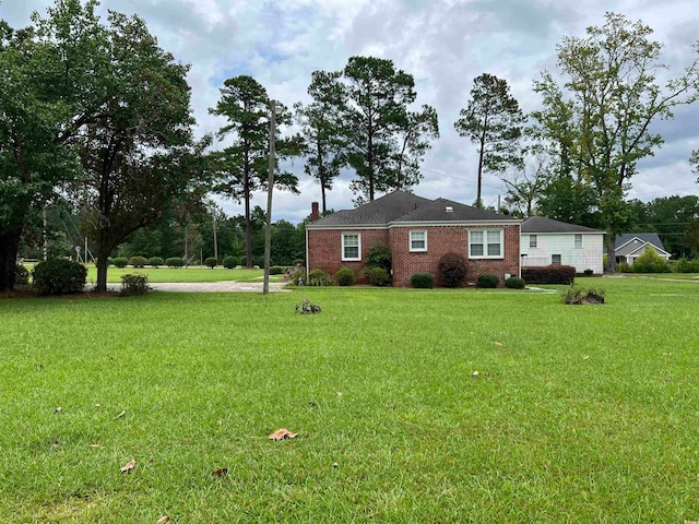 view of front of home with a front yard