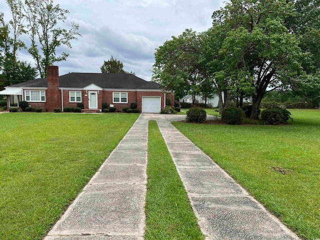 view of front of house featuring a garage and a front yard