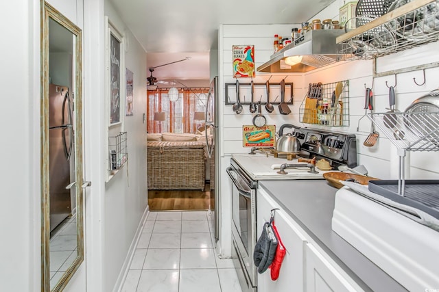 kitchen featuring light tile patterned floors, white cabinetry, and appliances with stainless steel finishes