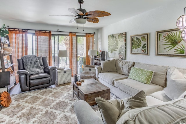 living room featuring ceiling fan, plenty of natural light, and hardwood / wood-style floors