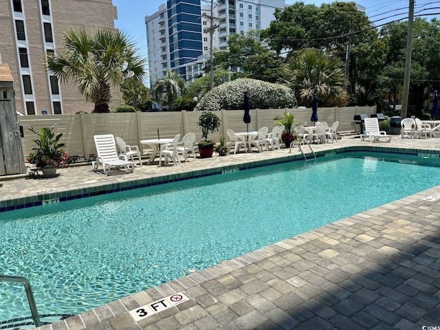 view of pool featuring a patio