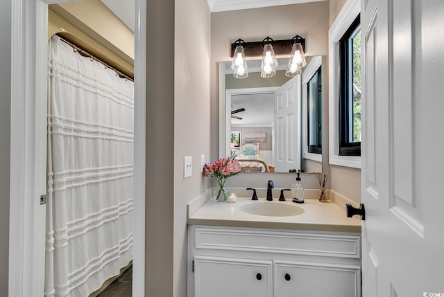 bathroom featuring ornamental molding and vanity