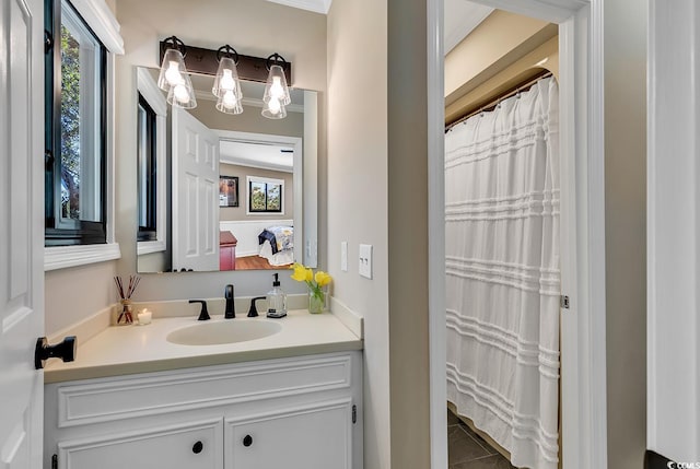 bathroom with vanity, tile patterned floors, and crown molding