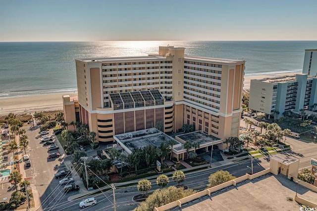 bird's eye view with a water view and a view of the beach