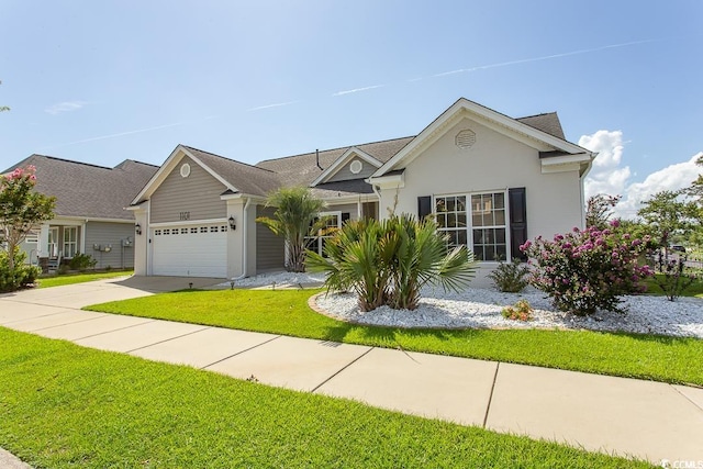 view of front of house with a front yard and a garage