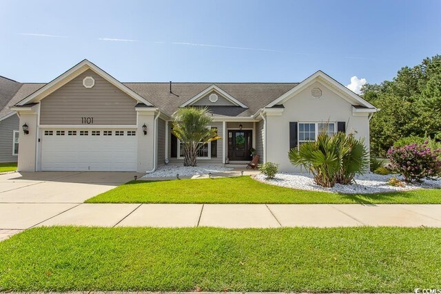 ranch-style house featuring a garage and a front lawn