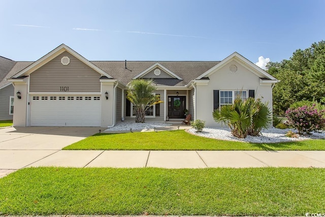 ranch-style house featuring a garage and a front lawn