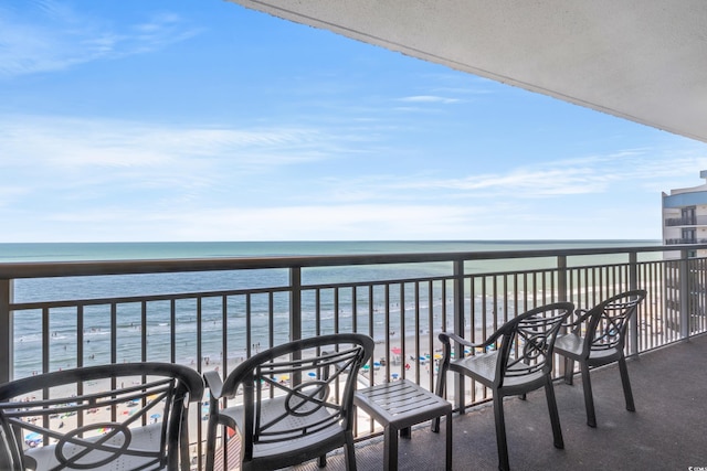 balcony featuring a water view