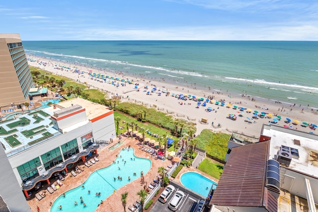 aerial view featuring a view of the beach and a water view