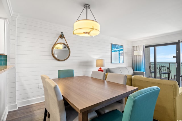 dining space with dark wood-type flooring