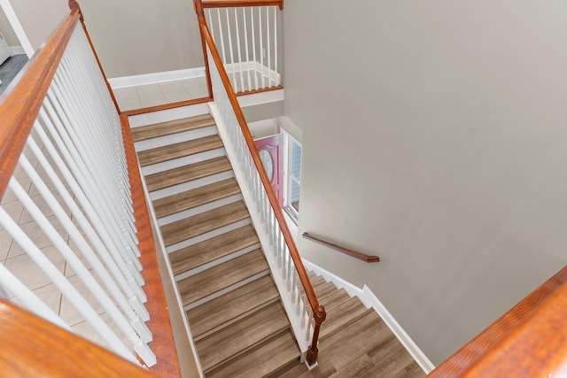 stairs with wood-type flooring