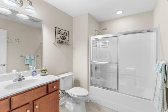 full bathroom featuring tile patterned floors, enclosed tub / shower combo, toilet, and vanity