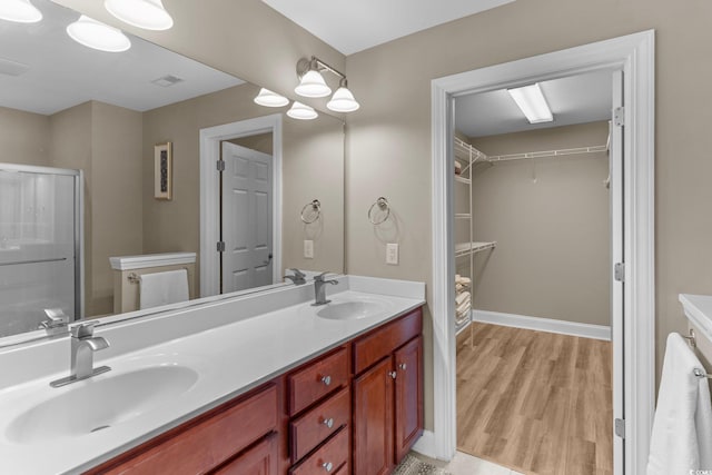 bathroom featuring vanity and hardwood / wood-style floors