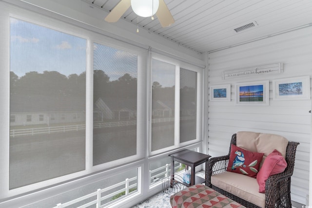 sunroom / solarium with ceiling fan