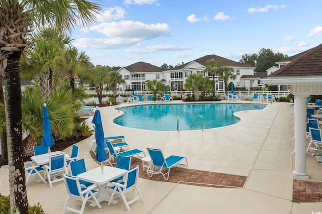 view of swimming pool featuring a patio area