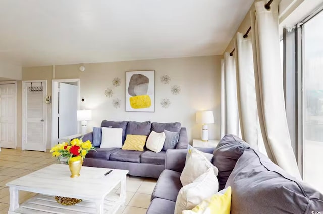 dining room featuring a drop ceiling, floor to ceiling windows, and ceiling fan