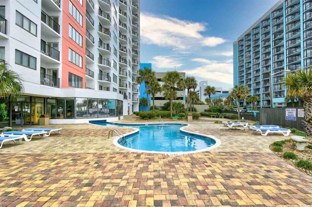 view of swimming pool with a patio