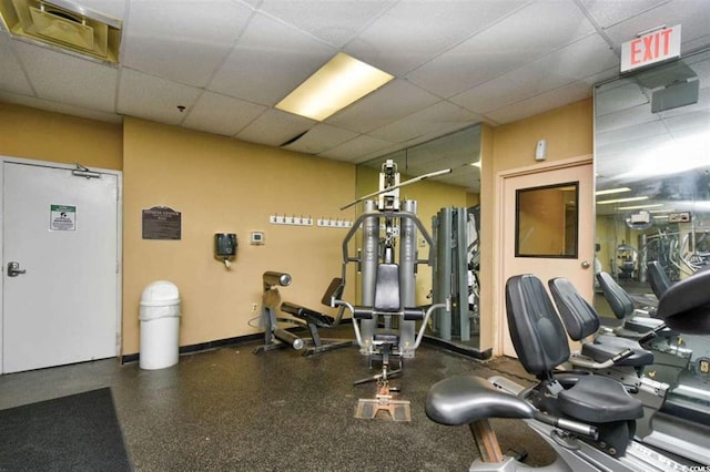 workout area featuring a drop ceiling