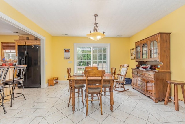 dining room with light tile patterned floors