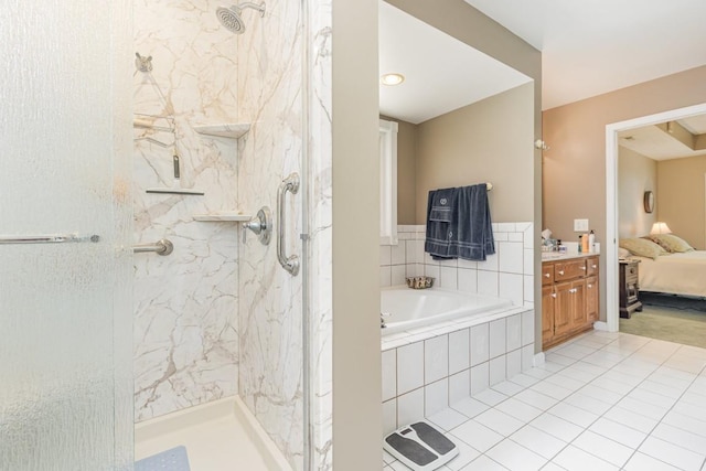 bathroom featuring vanity, tile patterned floors, and plus walk in shower