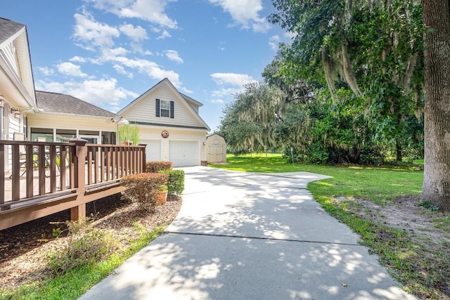 view of side of home featuring a shed, a wooden deck, a yard, and a garage