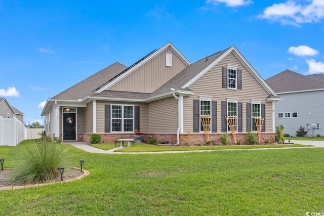 craftsman house with a front lawn