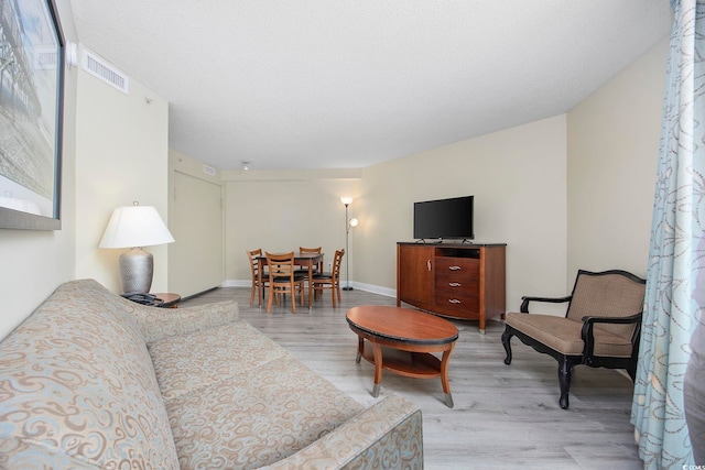 201 S Ocean Blvd Unit 1005, Myrtle Beach, SC 29577 - living room with visible vents and light wood finished floors